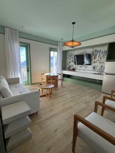 a living room with a couch and a table at The Pass Bungalows in Pass Christian