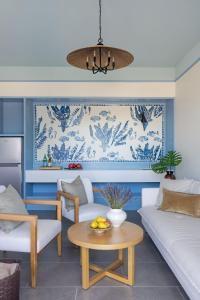 a living room with a couch and a table at The Pass Bungalows in Pass Christian +40 photos
