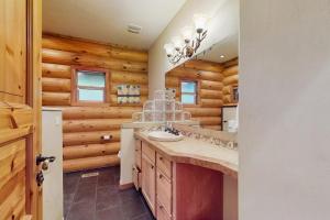 a bathroom with a sink and a mirror at The Dockside Gamehouse in Olympia +30 photos