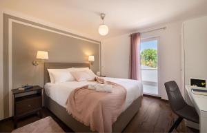 a bedroom with a large bed and a window at Villa Alba Moscenicka Draga in Mošćenice +22 photos