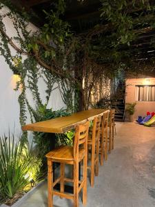 a row of wooden chairs sitting next to a table at Jacuzzi com vista! Espaço para eventos in Betim