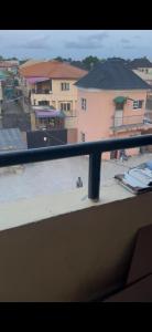 a balcony with a view of a beach and buildings at Rehoboth compound in Lekki