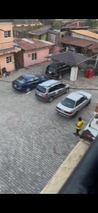 a group of cars parked on a city street at Rehoboth compound in Lekki