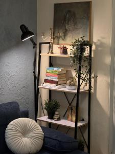 a room with a book shelf with books at Vanito Art Escape in Nesebar