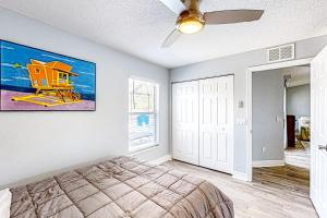 a bedroom with a bed and a ceiling fan at Poolside Oasis! Family-Friendly Summerfield Escape in Orange Blossom Hills +30 photos