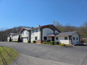 a row of buildings on a street at Super 8 by Wyndham Elkins in Elkins