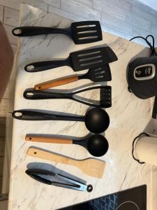a bunch of kitchen utensils sitting on a table at Quiet Private Room in El Pueblito