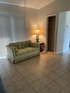 a living room with a couch and a table at Dolphin Cove in Sarasota