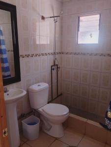 a bathroom with a toilet and a sink at Cabañas rústico in San Pedro de Atacama +6 photos