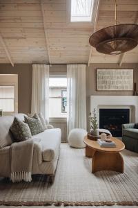 a living room with a couch and a table at Townie 2 - The Sage by Juniper Holiday + Home Unit in Union Pier +31 photos