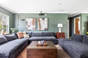 a living room with a couch and a coffee table at The Birdcage by Juniper Holiday + Home in Douglas