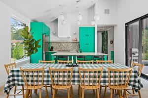 a dining room with a table and chairs at Owlwood by Juniper Holiday + Home in Harbert