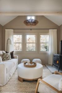a living room with a white couch and a table at Townie 4 - The Fern by Juniper Holiday + Home in Union Pier