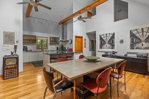 a kitchen and dining room with a wooden table and chairs at Casa Azur by Juniper Holiday + Home in Union Pier