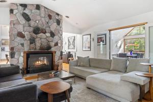 a living room with a couch and a fireplace at Casa Azur by Juniper Holiday + Home in Union Pier