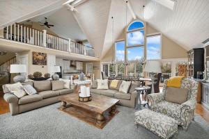 a large living room with couches and a table at Main Destination by Juniper Holiday + Home in Grand Beach