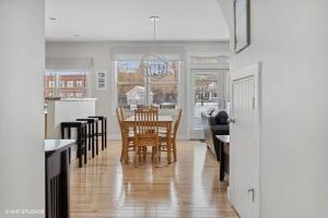 a kitchen and dining room with a table and chairs at Schoolhouse Rock by Juniper Holiday + Home in New Buffalo +23 photos