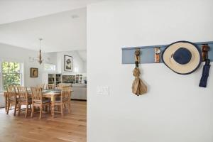 a kitchen and dining room with a camera on the wall at Greystone Cottage by Juniper Holiday + Home in Union Pier +38 photos