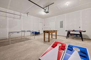 a room with two ping pong tables and a ping pong table at Sandy Shores in South Haven