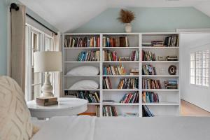 a room with a book shelf filled with books at Rabbit Run by Juniper Holiday + Home in Sawyer