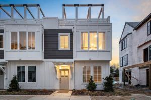 a large white house with a lot of windows at The Happy Place by Juniper Holiday + Home in Union Pier