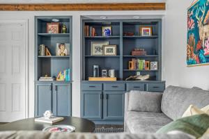 a living room with a blue book shelf at Golden Crest Getaway in Stevensville