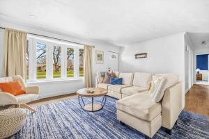 a living room with a couch and a table at Golden Crest Getaway in Stevensville +34 photos