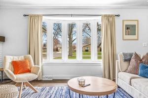 a living room with a couch and a large window at Golden Crest Getaway in Stevensville