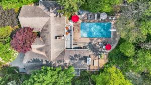 an overhead view of a house with a swimming pool at Hearth & Timber in Bridgman