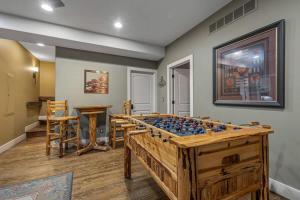 a game room with a wooden chess board at Lodged in the Trees in New Buffalo