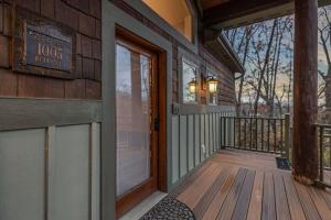 a front door of a house with a porch at Lodged in the Trees in New Buffalo +36 photos