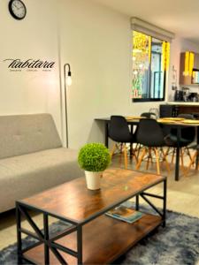a living room with a couch and a coffee table at Habitara - Carancho in Atasta de Serra