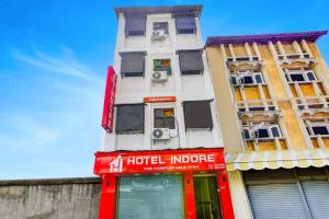 a building with a hotel indore sign on it at Hotel Indore Palace Nagpada in Mumbai