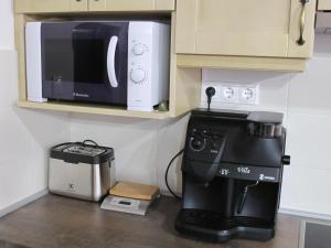 Kuchyň nebo kuchyňský kout v ubytování Tündérgyöngye Apartmanház