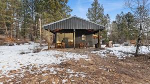 a cabin in the woods in the snow at Yurt 2 - The Gold Miner in Idaho City