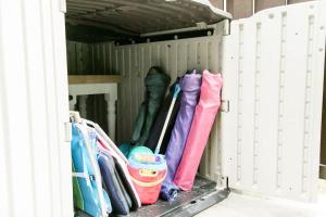 a row of umbrellas in a storage box at Perfect Small Family Beach Condo in Saint Simons Island +20 photos