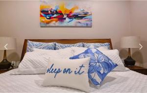 a bed with a pillow that says sleep on it at Escape to Paradise in Tangolunda