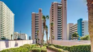 a city with palm trees and tall buildings at Lifes a beach on Myrtle Beach in Myrtle Beach