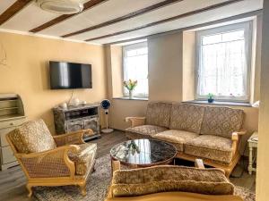 a living room with a couch and a table at Holiday Home in Konz in Konz