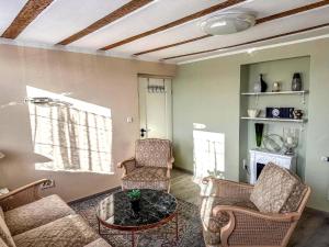 a living room with a couch and chairs and a table at Holiday Home in Konz in Konz