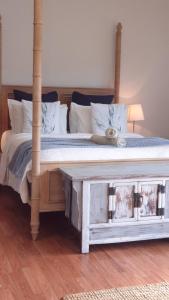 a bedroom with a bed with a wooden bed frame at Stylish Studio in Reedy Creek in Gold Coast