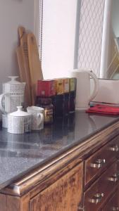 a counter top with spices and other items on it at Stylish Studio in Reedy Creek in Gold Coast