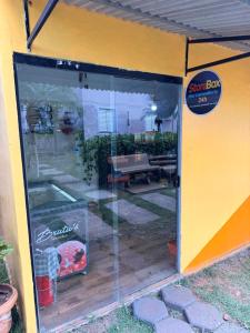 a sliding glass door to a patio in a backyard at Apartamento prox Praça Nova Shopping in Araçatuba