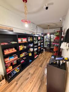 a room filled with lots of shelves filled with food at Apartamento prox Praça Nova Shopping in Araçatuba
