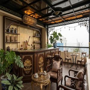 a restaurant with a bar with chairs and tables at Bảo Long Lào Cai Hotel in Lao Cai