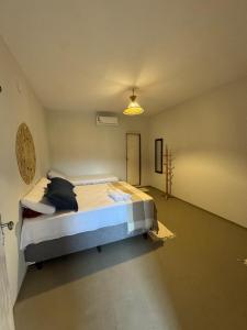 a bedroom with a large bed in a room at Pousada Raízzes in Amontada