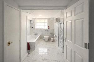 a white bathroom with a sink and a toilet at Entire Apartment hosted by Pius in Redhill
