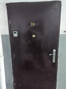 a black door with the number on it at Мерей 1 in Qyzylorda