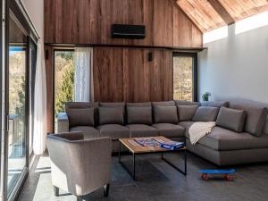 a living room with a couch and a table at Villa in Belgium with Private Terrace in La-Roche-en-Ardenne