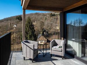 two chairs on a balcony with a view of a mountain at Villa in Belgium with Private Terrace in La-Roche-en-Ardenne